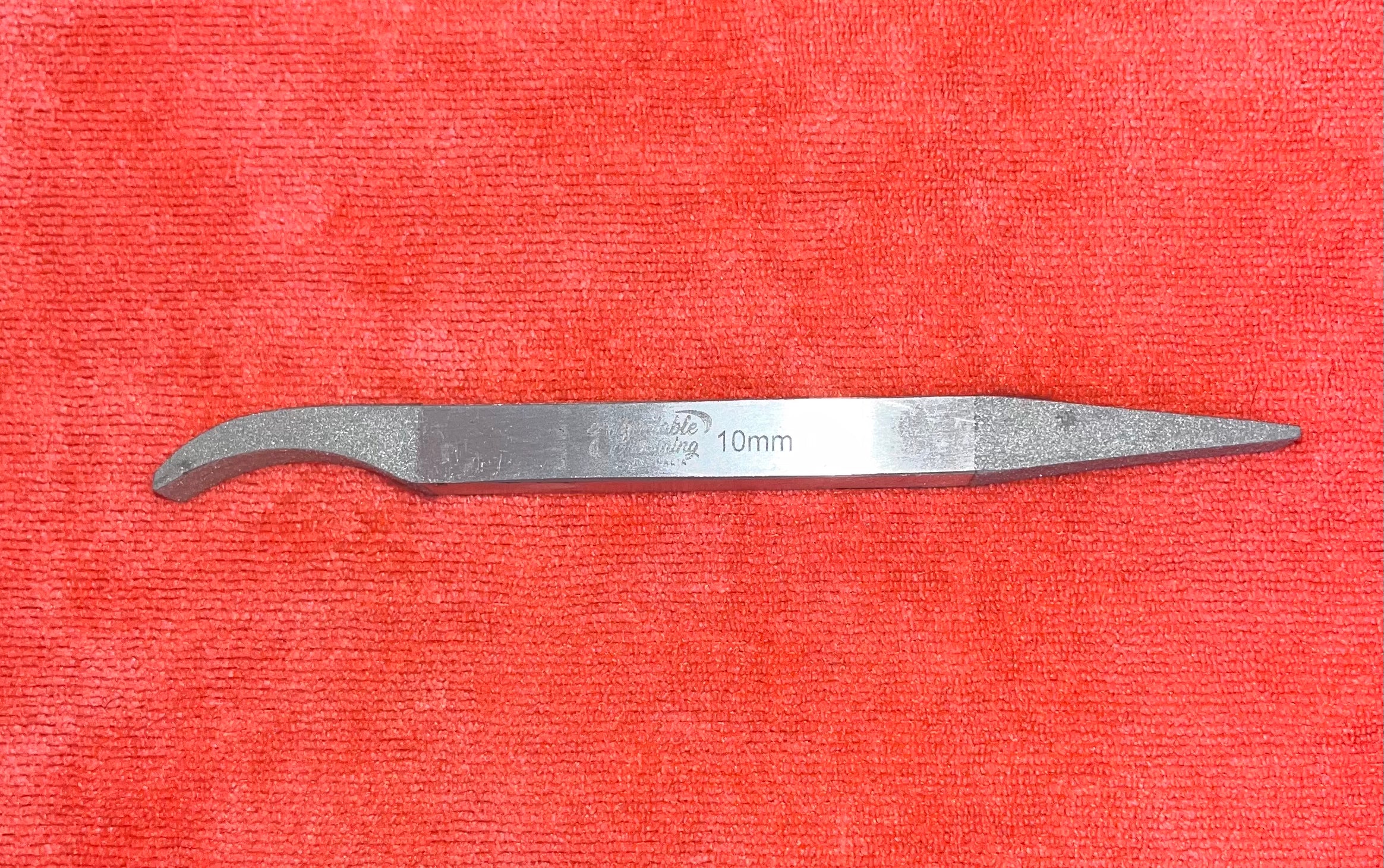 Two sided stripping stone for hand stripping